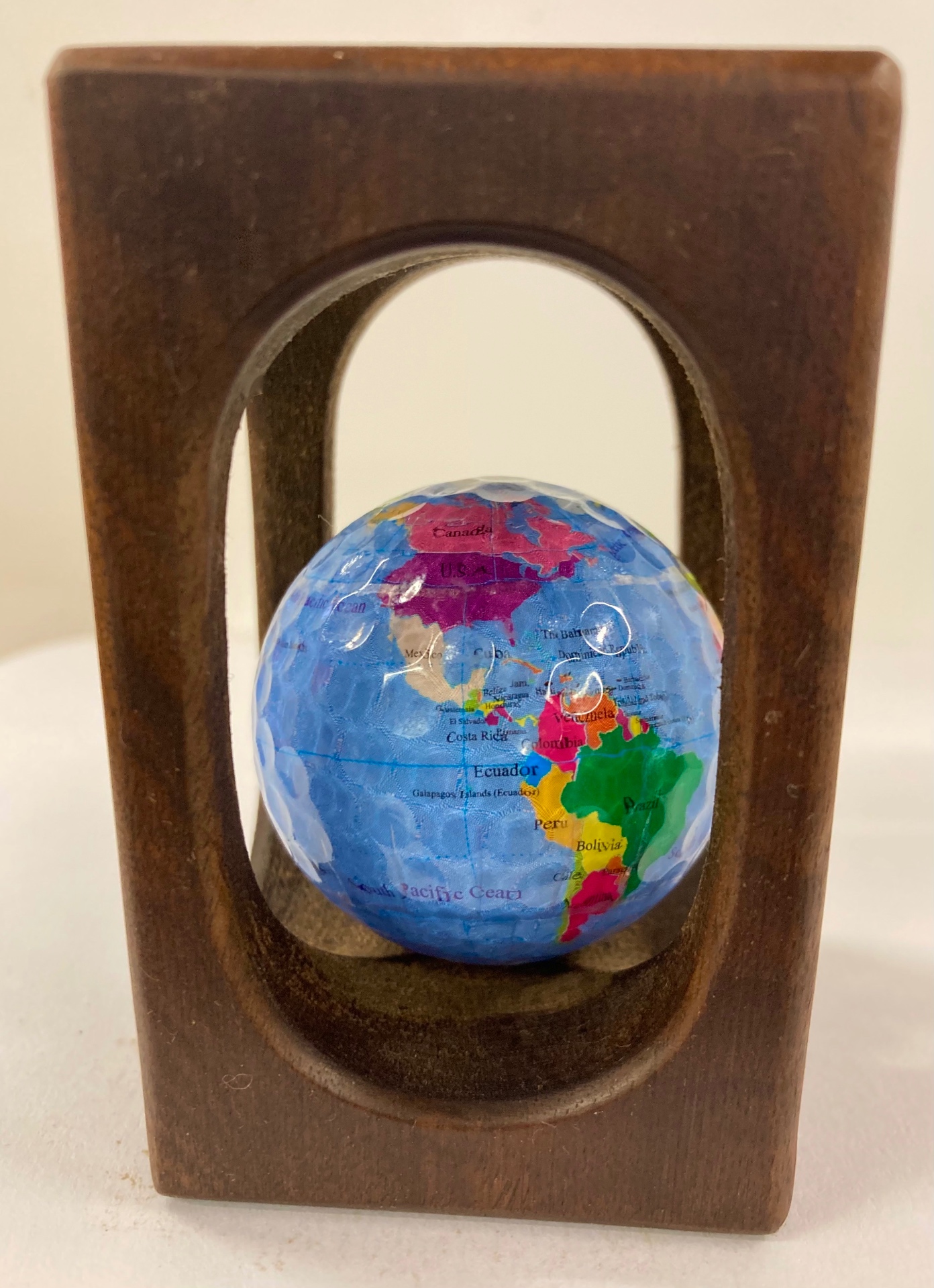 The World — handmade golf ball fidget in hardwood crate